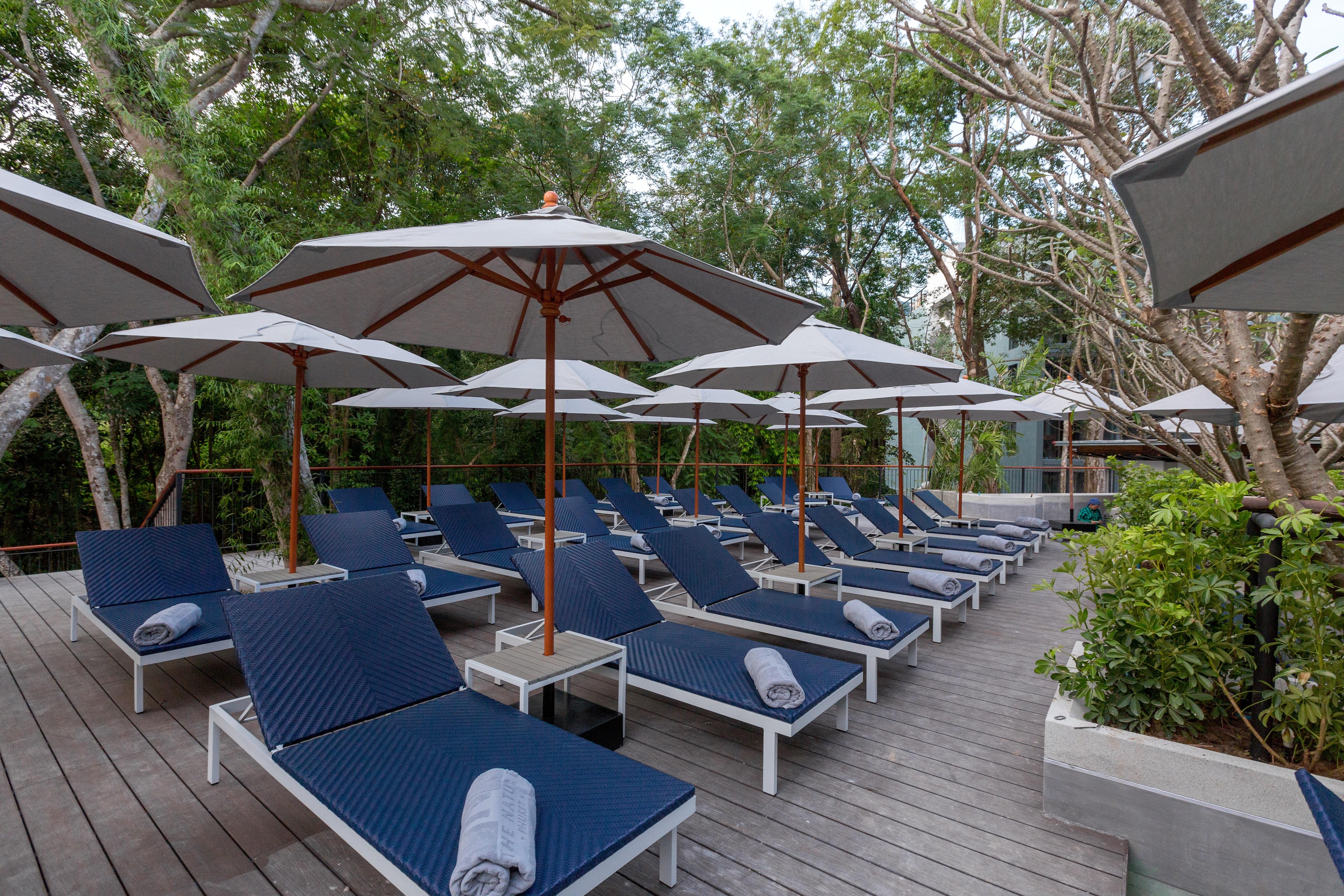 The Nature Phuket - Sha Extra Plus Exterior foto The pool deck at the hotel